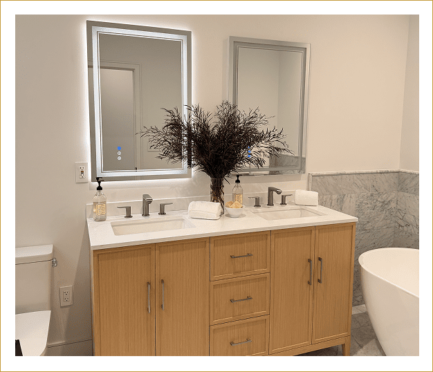 Modern bathroom vanity with dual sinks and a large mirror.